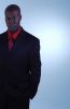 Businessman in black suit and red shirt 1.jpg