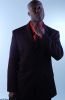 Businessman in black suit and red shirt.jpg