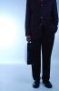 Businessman in black suit holding briefcase 1.jpg