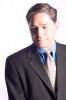 Businessman in suit and tie looking downwards.jpg
