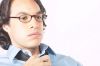 Businessman loosening his tie.jpg