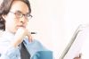 Businessman reading newspaper 100.jpg