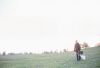 Businessman standing in field with open briefcase 4.jpg