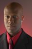 Businessman wearing red shirt and tie under black suit 100.jpg