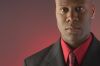 Businessman wearing red shirt and tie under black suit 3.jpg
