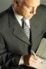 Businessman writing in day planner 3.jpg