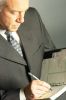Businessman writing in day planner 4.jpg