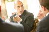 Businessmen having coffee uid 1433187.jpg