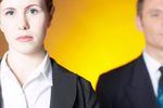 Businesswoman standing in front of businessman.jpg
