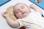 Caucasian baby sleeping on mat.jpg