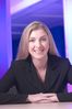 Caucasian business woman leaning on desk an 1.jpg