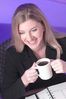 Caucasian businesswoman drinking coffee.jpg