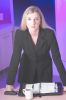 Caucasian businesswoman leaning on desk with day planner and coffee mug.jpg
