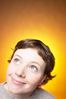 Caucasian woman smiling against yellow background.jpg