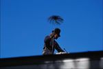 Chimney sweep on roof.jpg