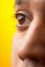 Close up of half of South Asian man face against yellow backgr 3.jpg