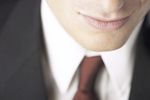 Close up of mans face wearing suit uid 1285183.jpg