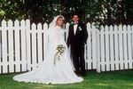 Couple standing in front of fence.jpg