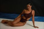 Dark skinned woman in maroon bathing suit.jpg