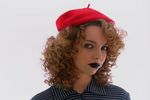 Female model with curly hair and hat.jpg