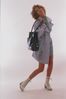 Female model with purse and boots.jpg