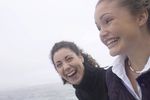 Giggling women standing on edge of water.jpg