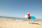 Girl holding surfboard uid 1430353.jpg