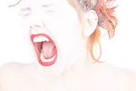Headshot of Caucasian woman yelling with eyes closed.jpg