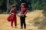 Kids walking down dirt road.jpg