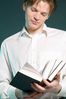 Male adult reading book uid 1453413.jpg