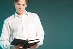 Male adult reading book uid 1453417.jpg