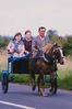 Man and girls on horse drawn cart.jpg