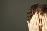 Man covering his eyes.jpg