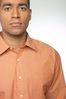 Man in orange shirt.jpg