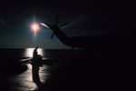 Man in silhouette at dock in North West Territories Tuktut Nogait 2.jpg