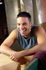Man leaning against crate laughing uid 1280671.jpg