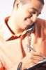 Man talking on telephone and writing in day planner.jpg