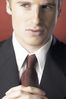 Man wearing suit and folding hands.jpg