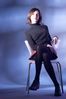 Seated woman in black turtleneck and skirt 2.jpg
