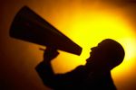 Silhouette of man yelling into a bullhorn 2.jpg