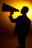 Silhouette of man yelling into a bullhorn.jpg