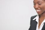 Smiling businesswoman in black suit 1.jpg