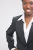 Smiling businesswoman in black suit.jpg
