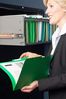 Smiling businesswoman reading file.jpg