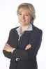 Smiling businesswoman with arms crossed uid 1280851.jpg