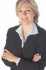 Smiling businesswoman with arms crossed.jpg