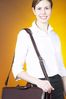 Smiling businesswoman with briefcase.jpg