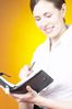 Smiling businesswoman writing in day planner 1.jpg