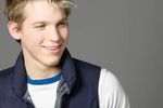Smiling male adult wearing down vest.jpg
