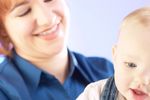 Smiling woman holding baby an 1.jpg